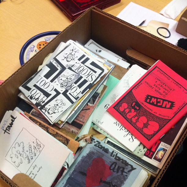 a box full of different zines